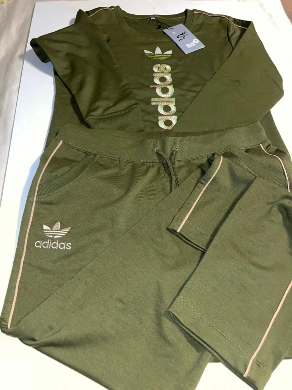 olive green Adidas matching sweatshirt and jogger set